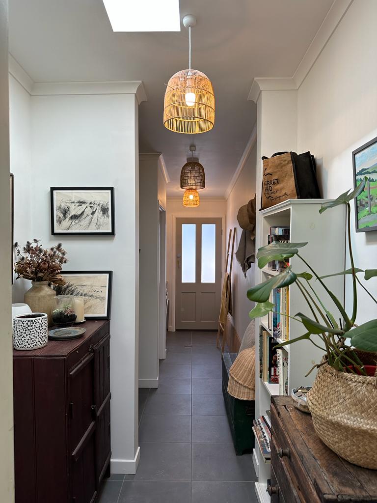 Looking along new passageway into extension with bathroom and bedroom on left