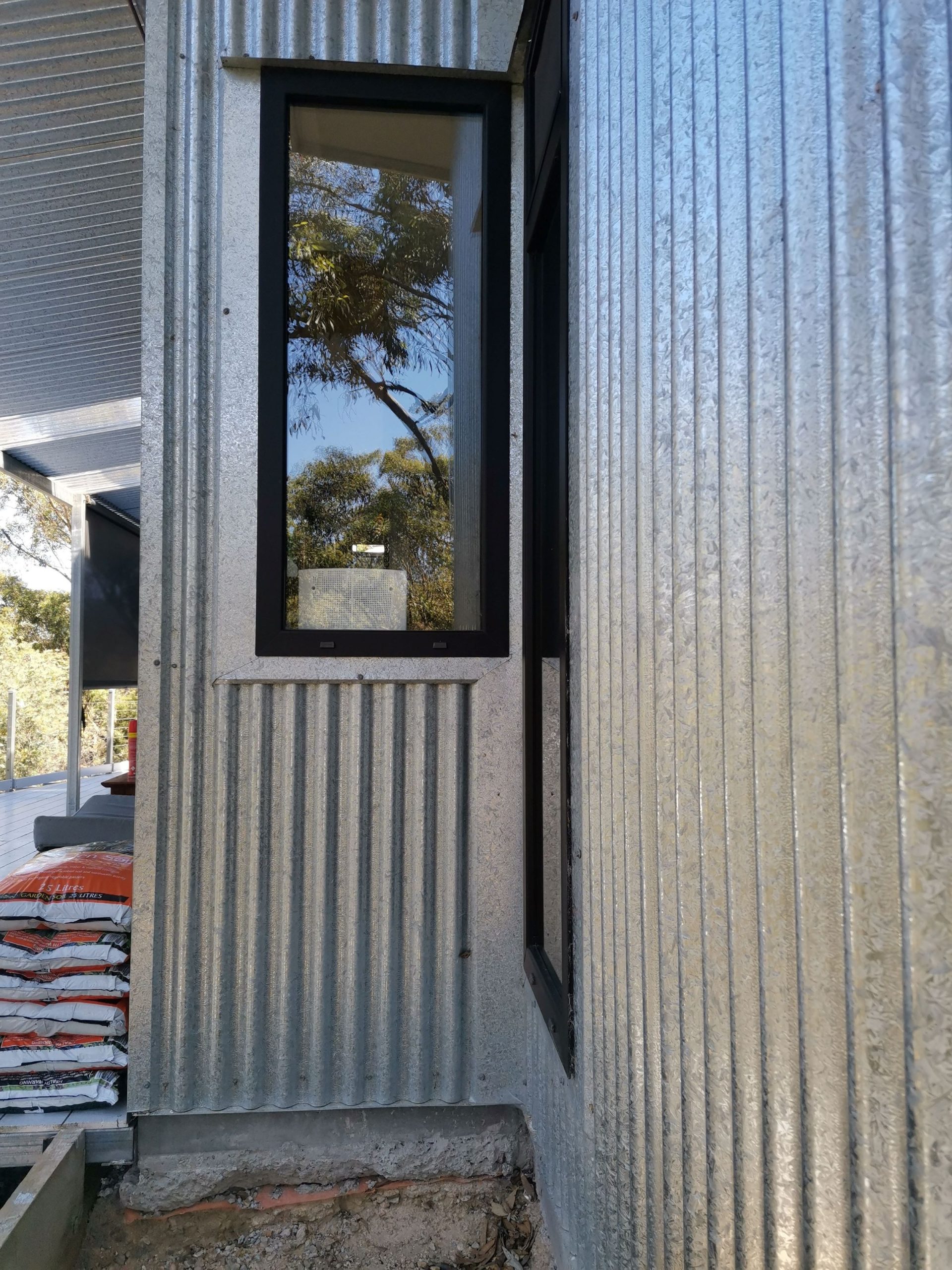 Vertical galv sheet detailing around window